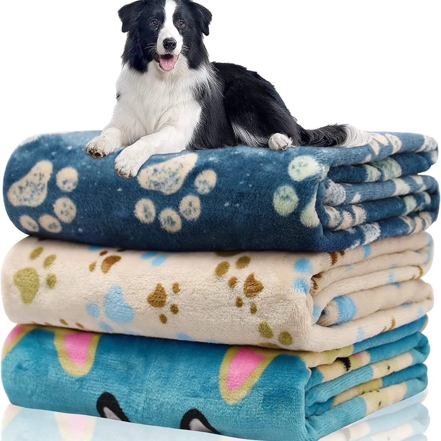 Blue cartoon dog print double-sided flannel pet blanket laid flat.