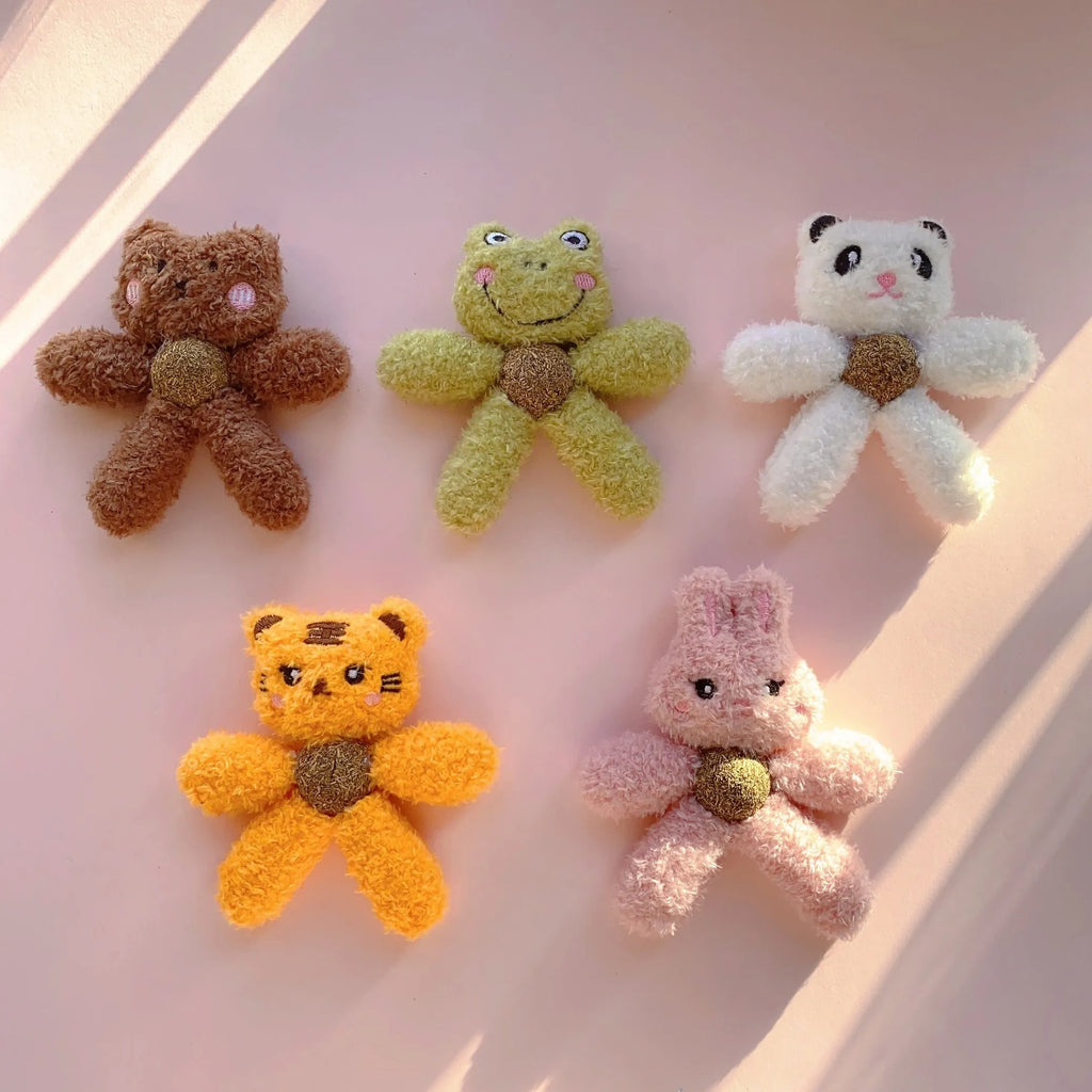 Soft stuffed catnip ball toy in animal design for chewing and play.