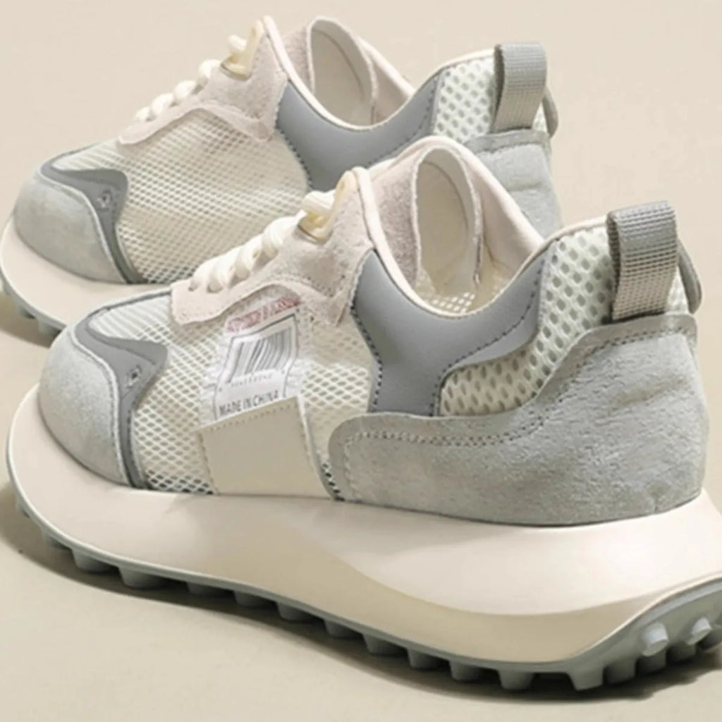 Women's grey and pink retro sneakers with low top design and rubber sole