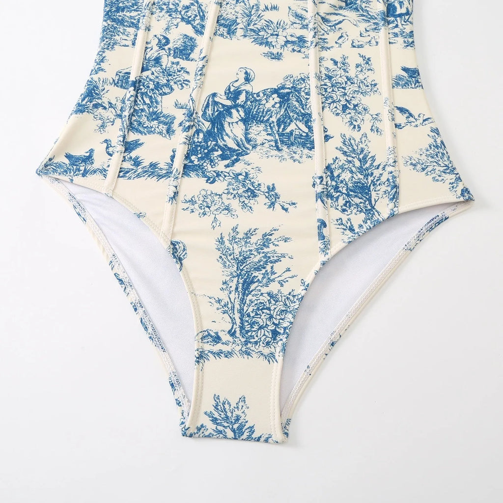 Women's patterned blue one-piece swimsuit with matching gauze skirt accessory