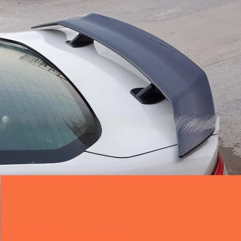 Universal car punch-free tail wing spoiler in ABS plastic on a vehicle