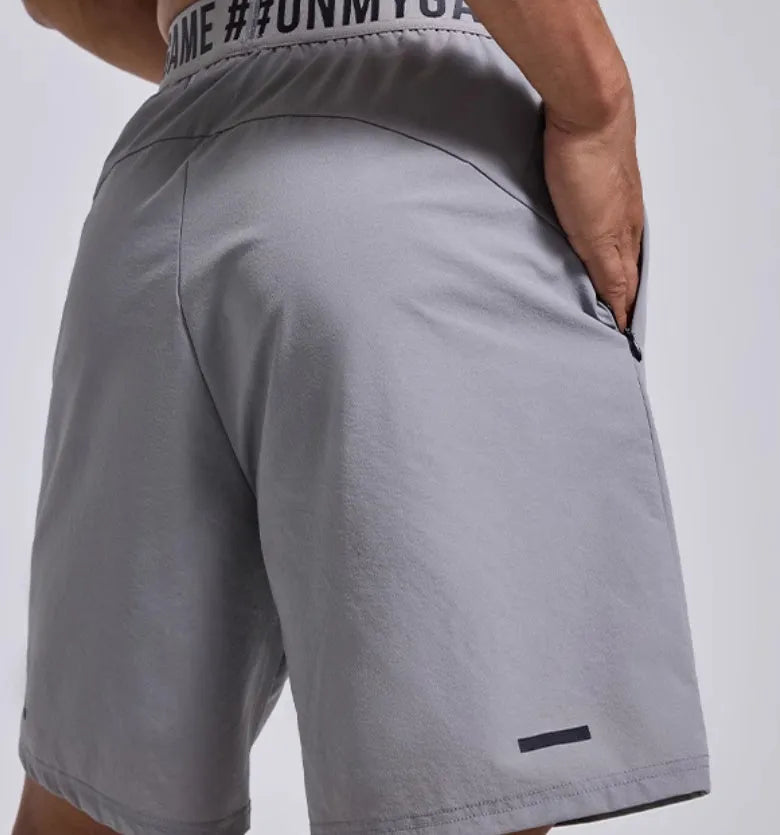 Men's loose fit cropped sports shorts in grey, blue or black with elastic waist