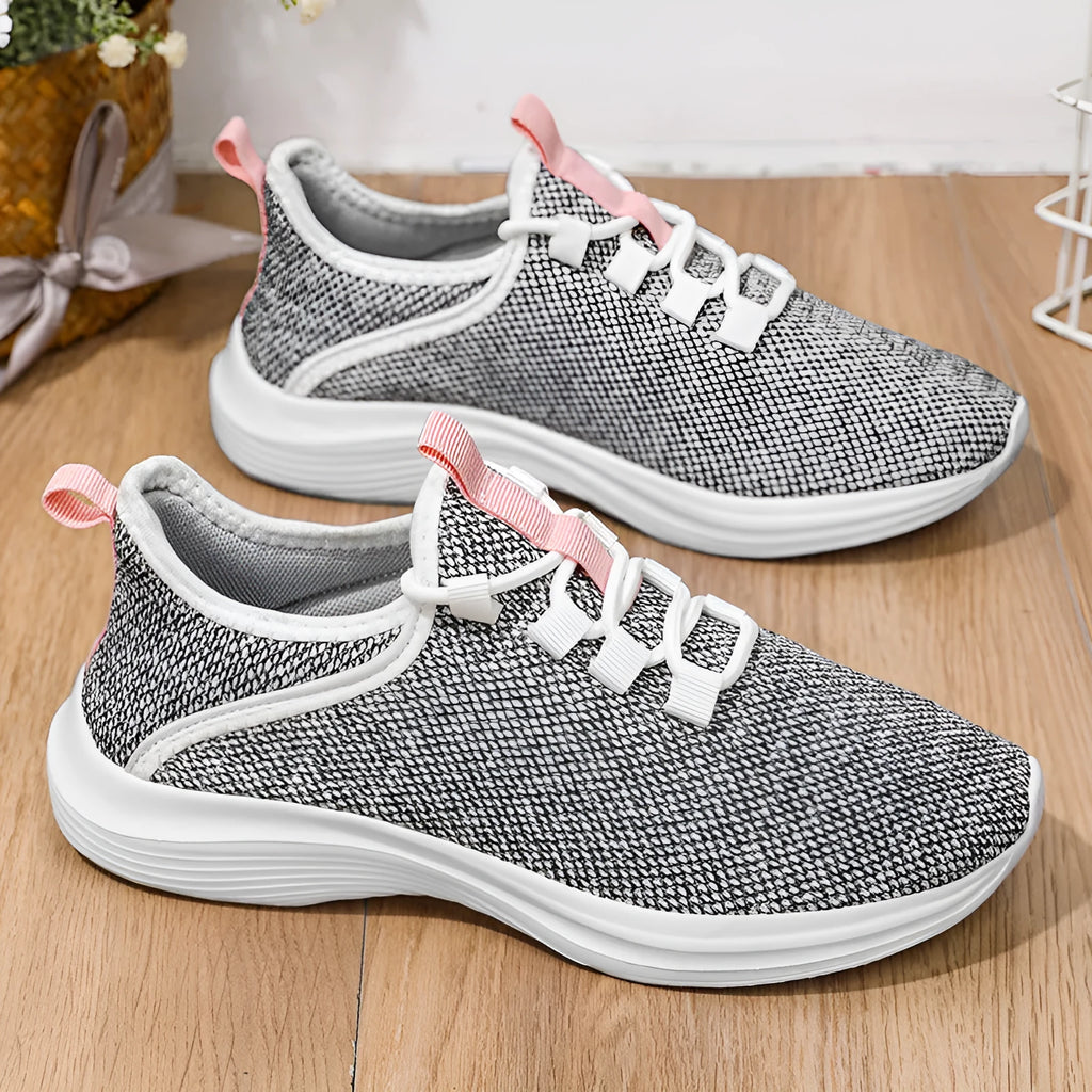 Women's breathable flyknit casual sneaker in black with lace-up front and low-top design