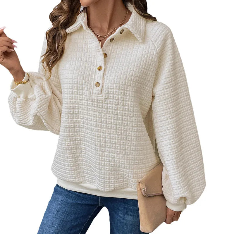 Women's beige polo collar pullover sweater with long sleeves, laid flat.