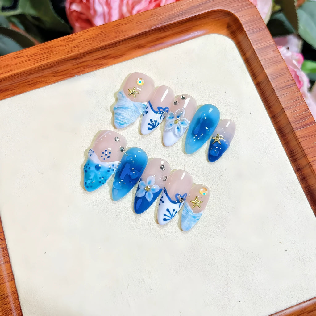 Blue hand-painted carved summer ice transparent plastic fake nails with decorative surface texture