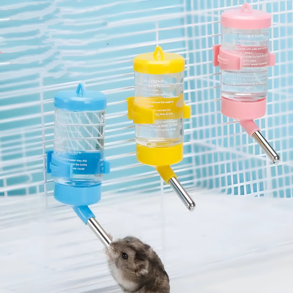 Green plastic ball kettle water feeder for small pets, attached to a cage, showing the drinking tube and ball valve.