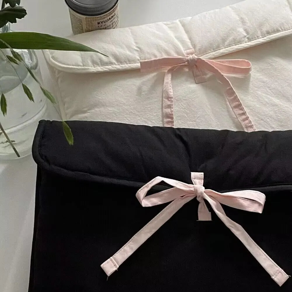 Women's quilted computer bag with ballet-style bow and striped pattern in black or white for 11-inch or 13-14-inch laptops