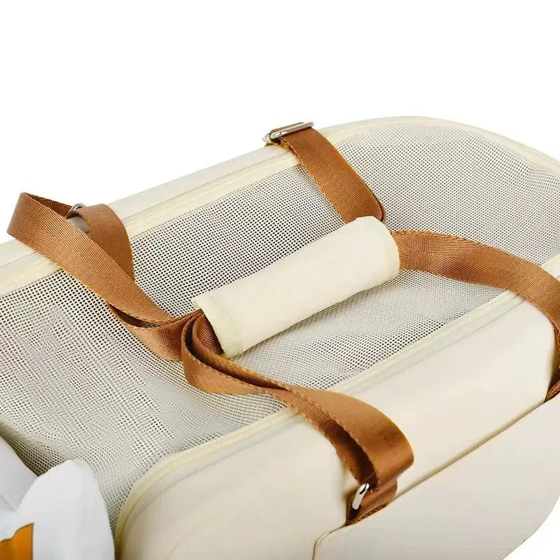 Beige hard-shell EPE padded portable cat carrier with one shoulder strap, shown next to measurements.