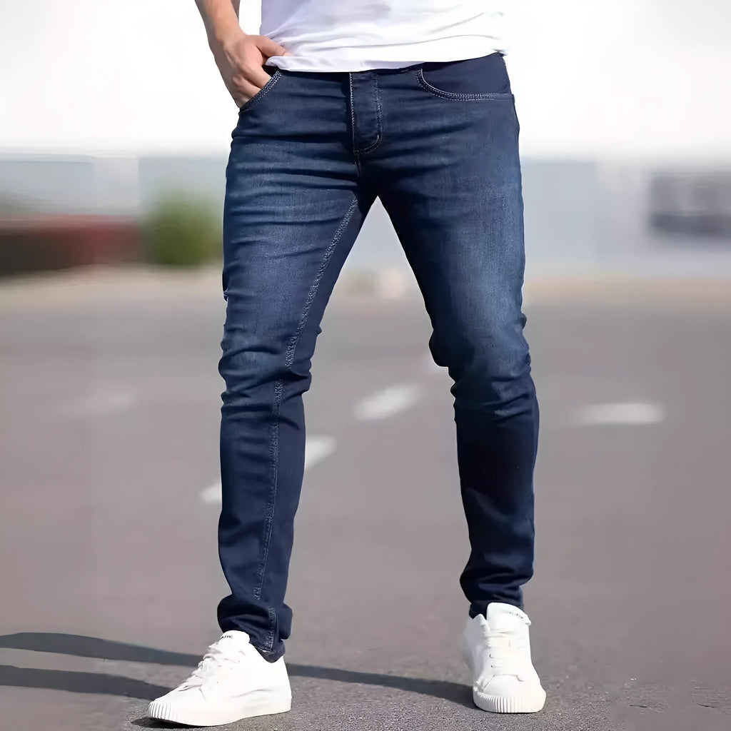 Men's slim-fit dark blue cotton jeans with mid waist and zipper fly