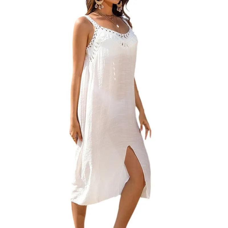 White crochet suspender beach dress with hollow weaving and bottom slit on mannequin