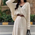 Beige hollow-out knitted two-piece skirt set with long sleeve top, mid-length skirt and belt