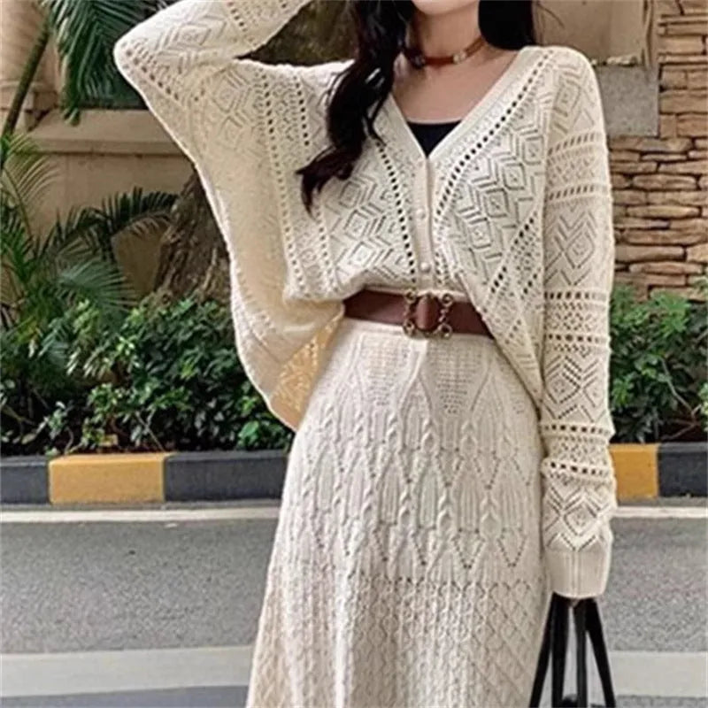 Beige hollow-out knitted two-piece skirt set with long sleeve top, mid-length skirt and belt
