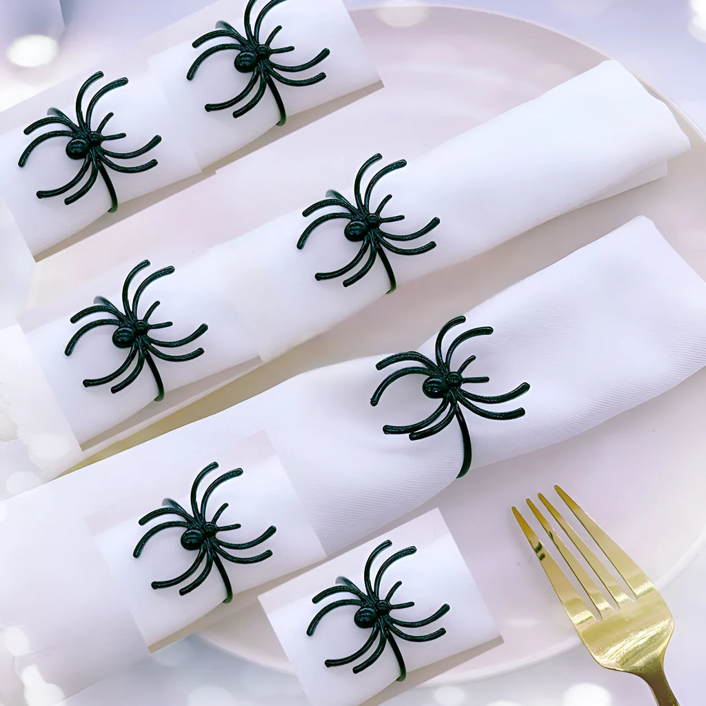 Six black spider-design alloy napkin rings for Halloween table settings