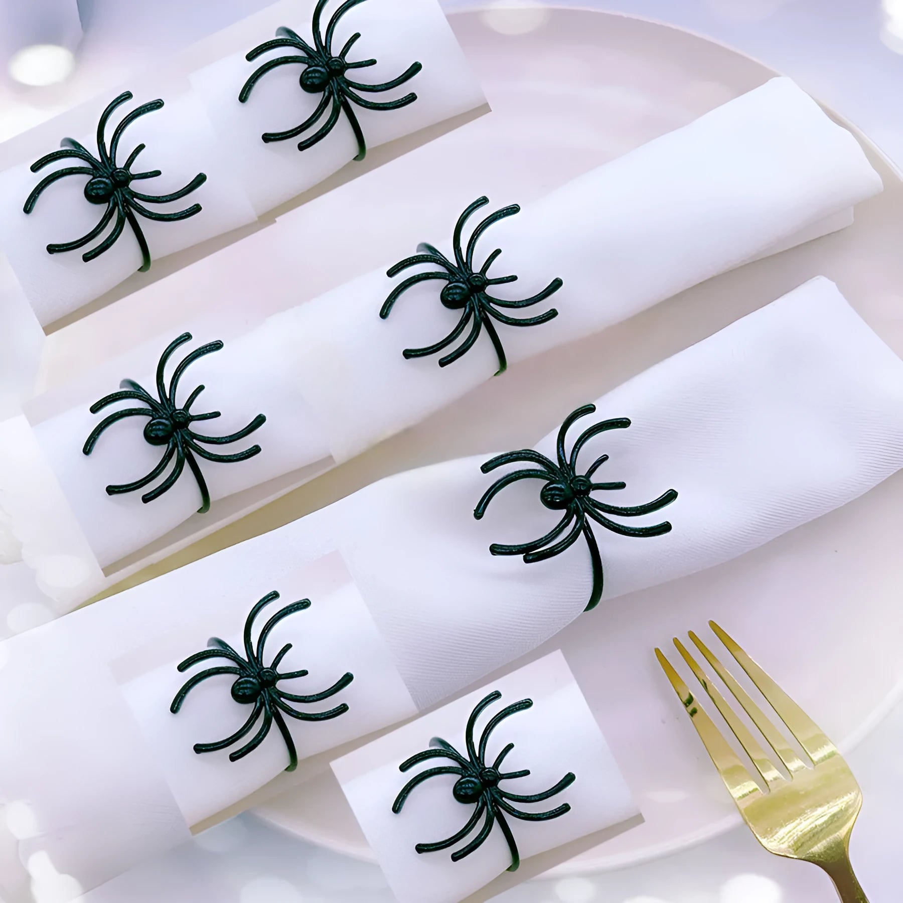 Six black spider-design alloy napkin rings for Halloween table settings