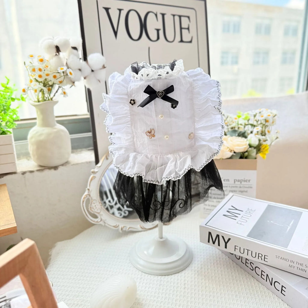 White polyester dog dress with a layered gauze skirt, shown on a small dog.