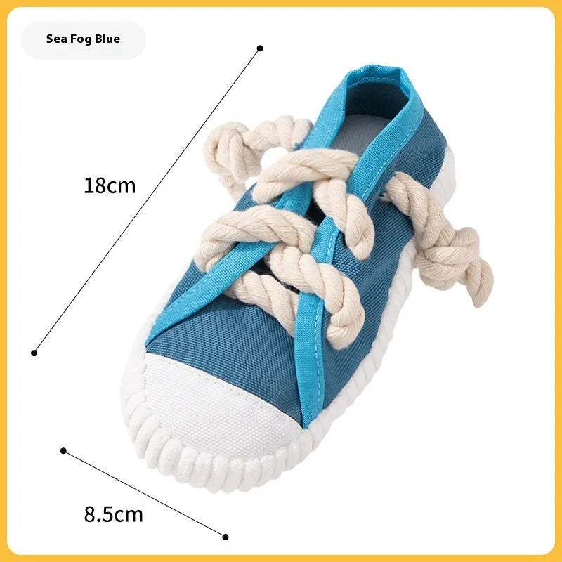 Slipper-shaped plastic dog chew toy with squeaker in three colour options