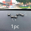 Small black cartoon-shaped resin briquette decorations for car interiors with traceless tape.