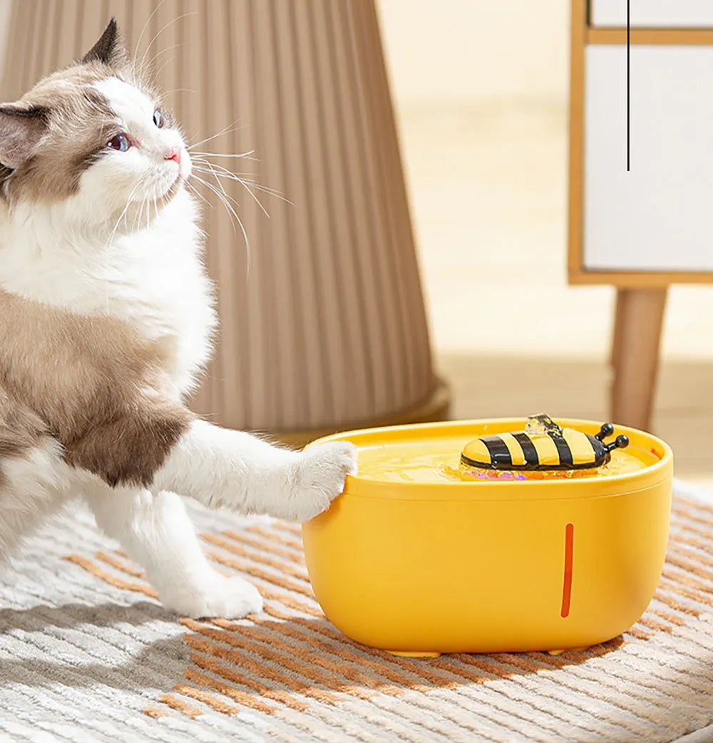 Yellow cat water fountain with filtration system, water level window, and USB connection
