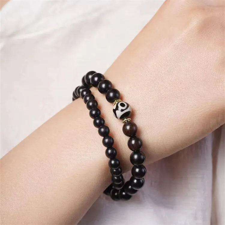 Ebony wood bracelet with 8mm beads and Tibetan two-circle pattern