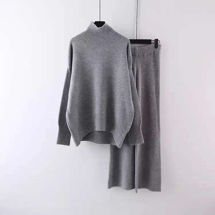 Women's beige acrylic sweater and wide-leg trousers two-piece set on a hanger