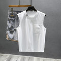 Loose fit solid colour cotton sleeveless t-shirt on a hanger, shown in white.