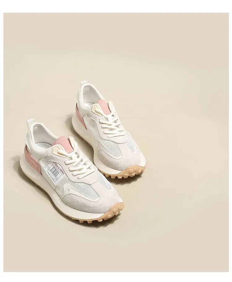 Women's grey and pink retro sneakers with low top design and rubber sole