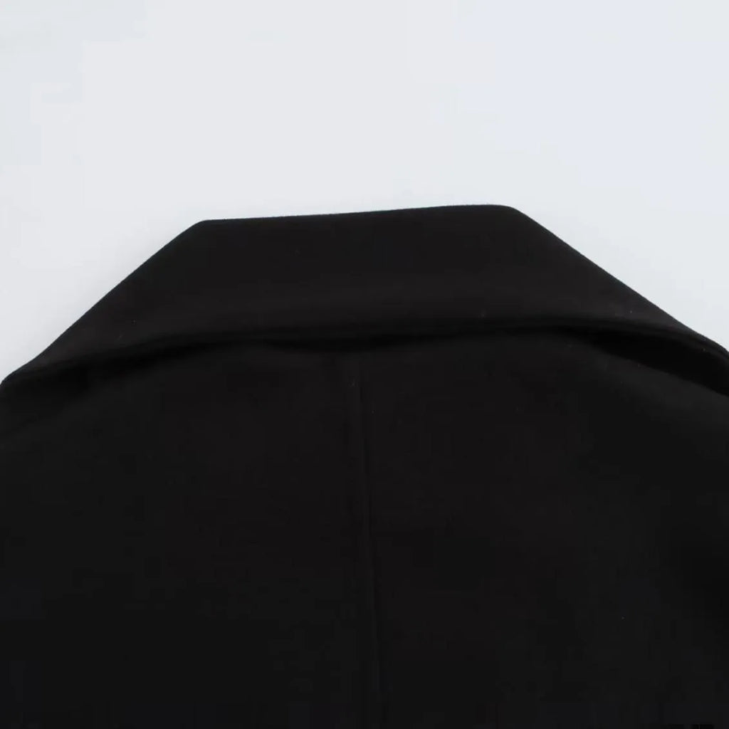 Women's long grey polyester coat with an artificial fur collar and pockets.