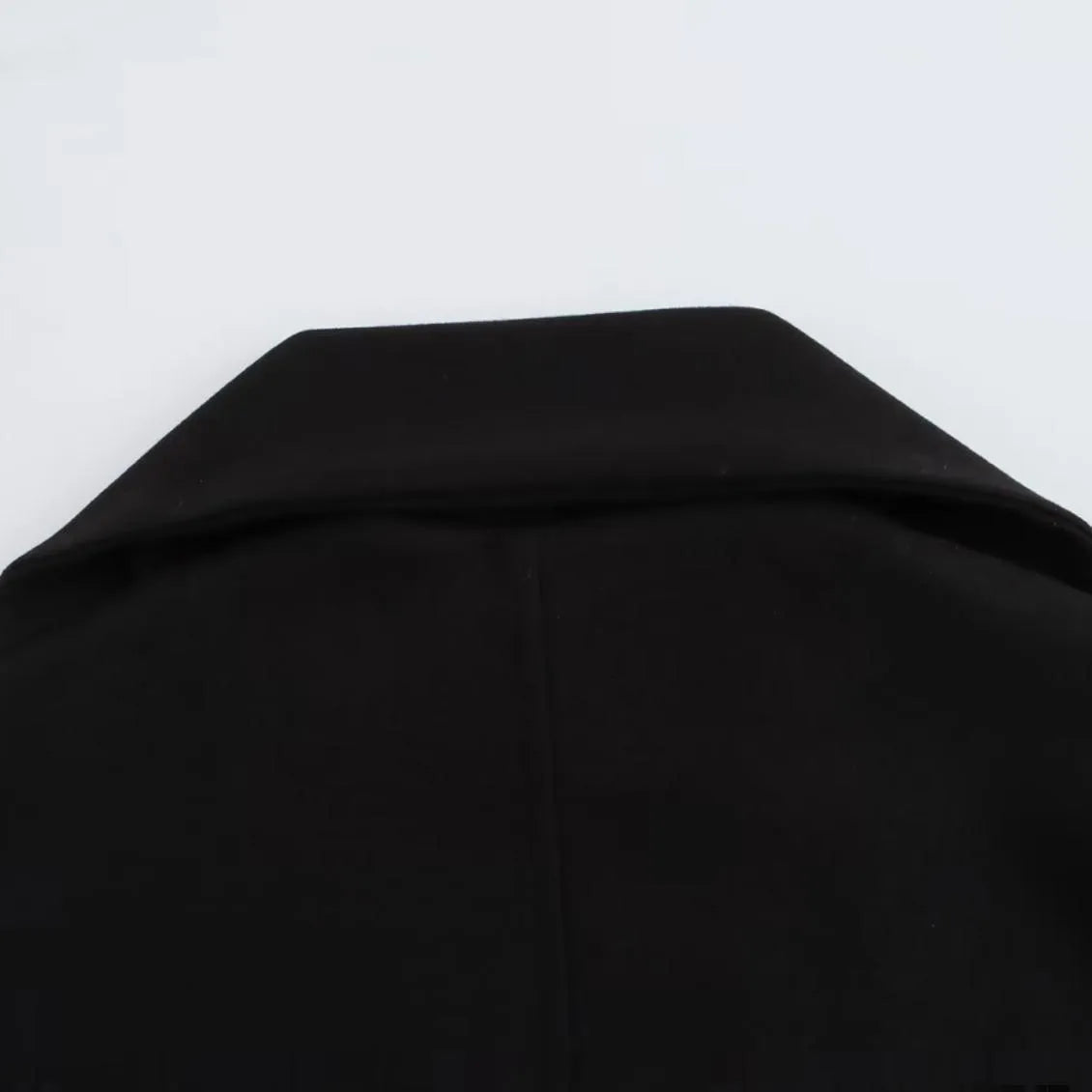 Women's long grey polyester coat with an artificial fur collar and pockets.