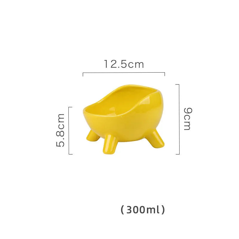 Green ceramic pet bowl with four legs and wide opening for cat or small dog feeding