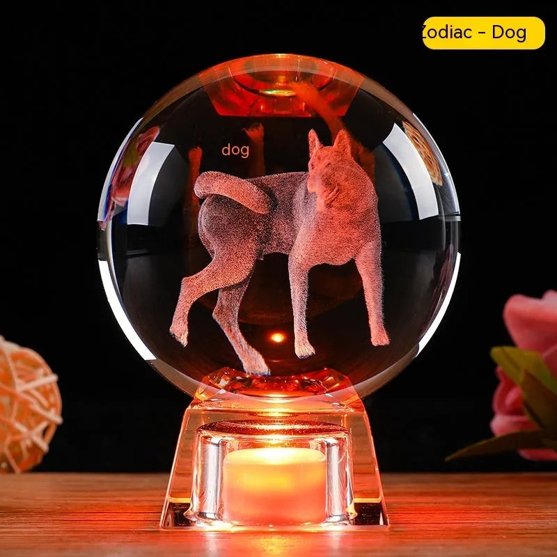 White crystal zodiac ornament with electronic luminous base showing Chinese animal design