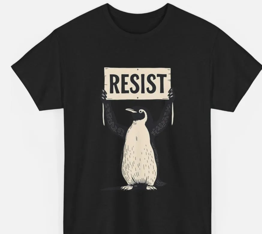 A loose-fit black cotton t-shirt with short sleeves and a round neck on a hanger.
