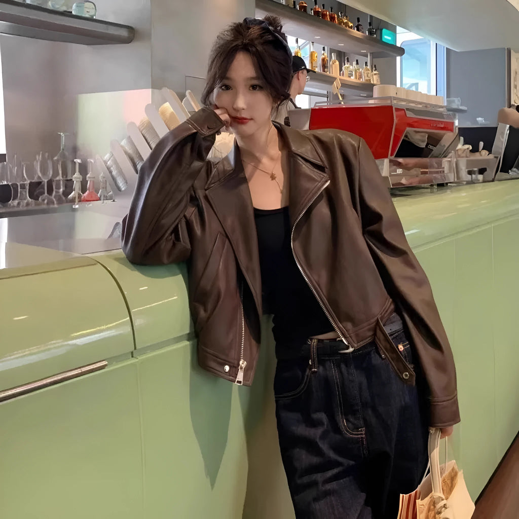 Women's slim-fit retro faux leather jacket in black or brown colour with short length and pocket details