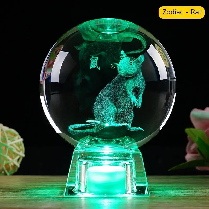 White crystal zodiac ornament with electronic luminous base showing Chinese animal design
