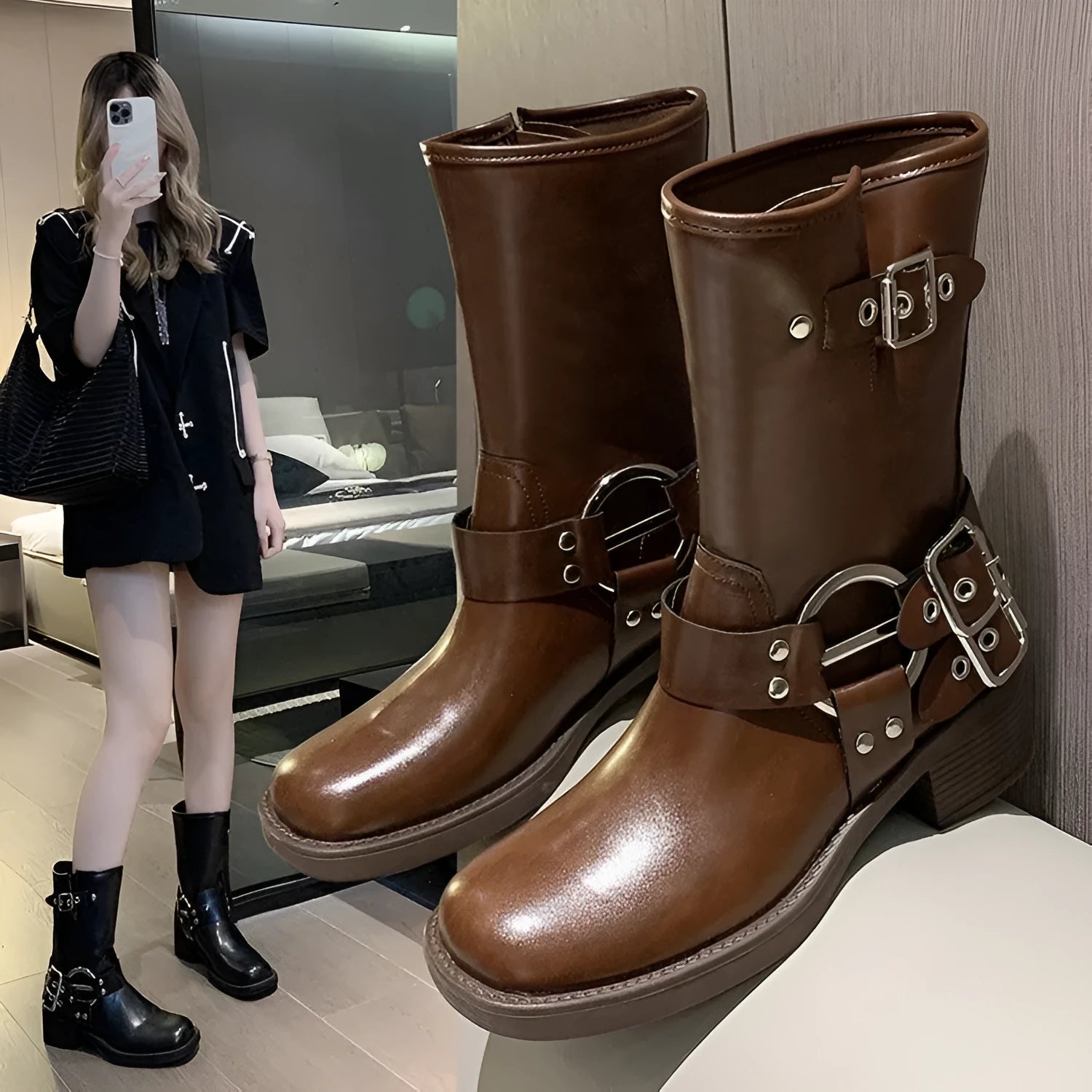 Women's black platform boots with buckle detail and mid-calf length