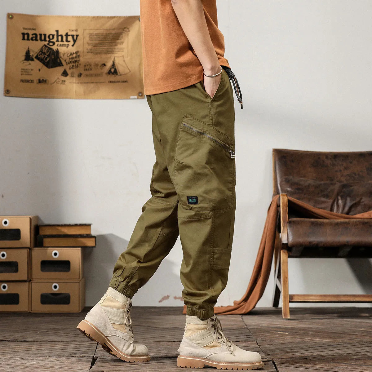 Men's khaki cotton harem pants with tapered ankle band and zip placket front view