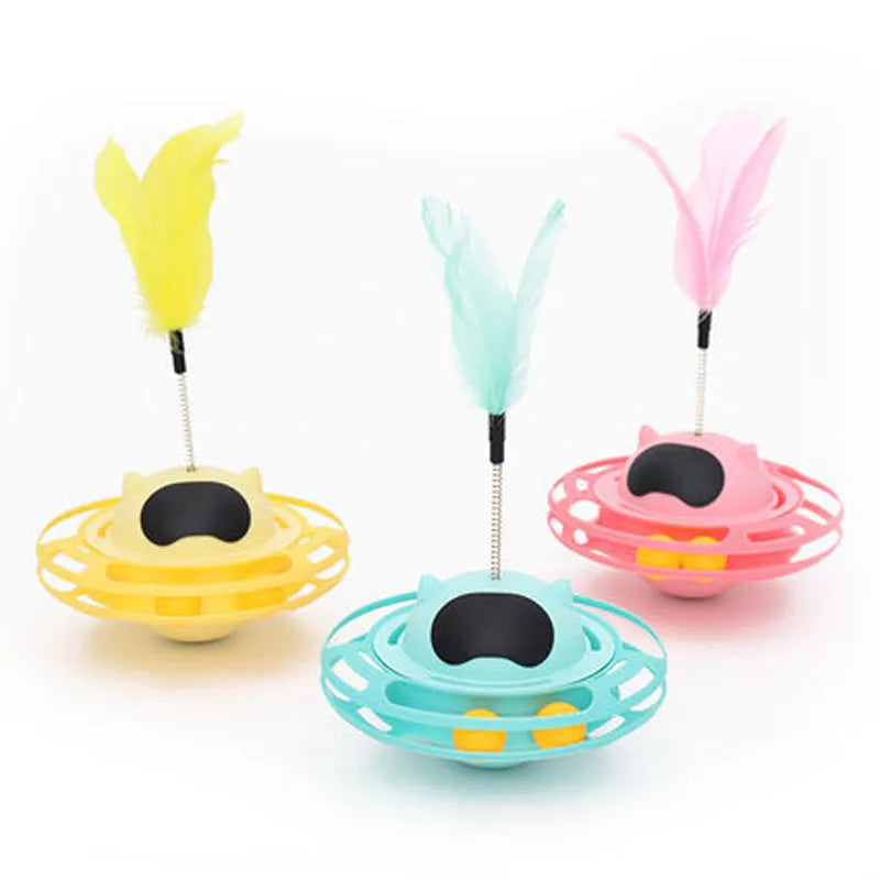 Pink cat tumble turntable toy with attached cat stick for interactive play