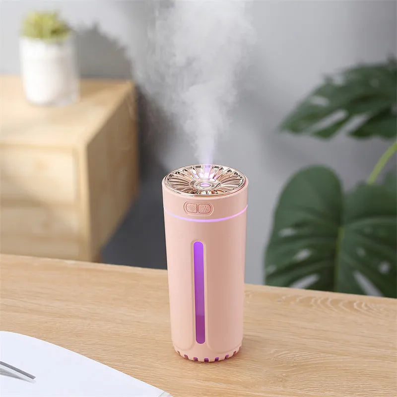 Black portable humidifier with LED lights showing dimensions and USB charging port