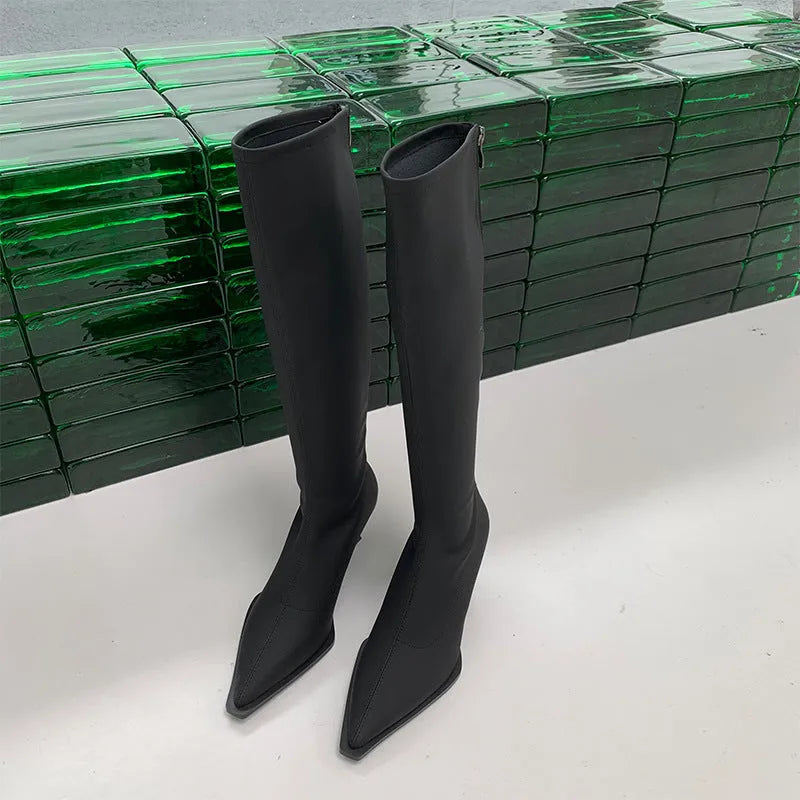 Black women's below knee pointed toe stiletto heel boots with a back zipper