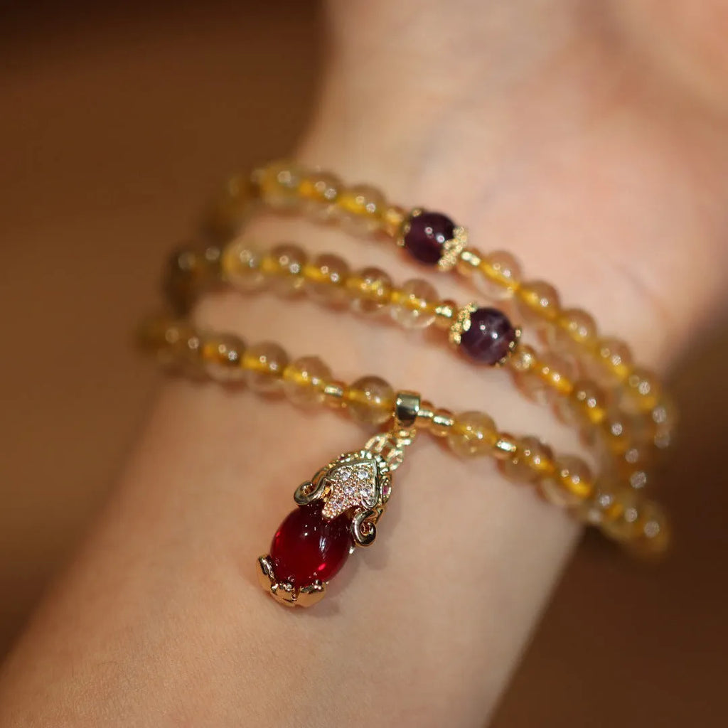 Natural Brazil gold rutilated quartz bracelet with Chinese style design and ruby quartz hanging chopsticks
