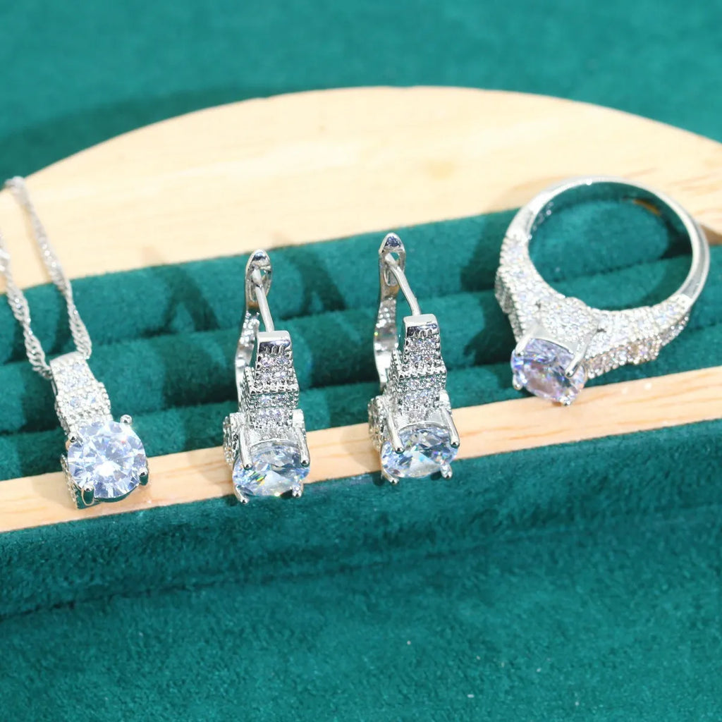 Bridal four-piece zircon jewellery set showing necklace, bracelet, earrings, and ring in alloy with water wave chain.
