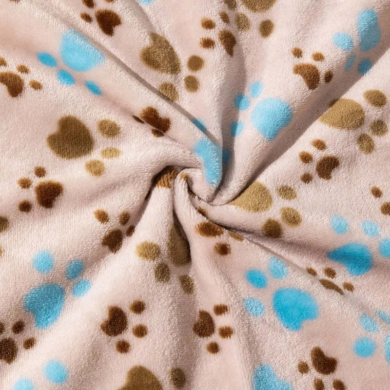 Blue cartoon dog print double-sided flannel pet blanket laid flat.