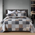 Quilted pure cotton bed cover set with printed design, includes bedspread and two pillowcases.