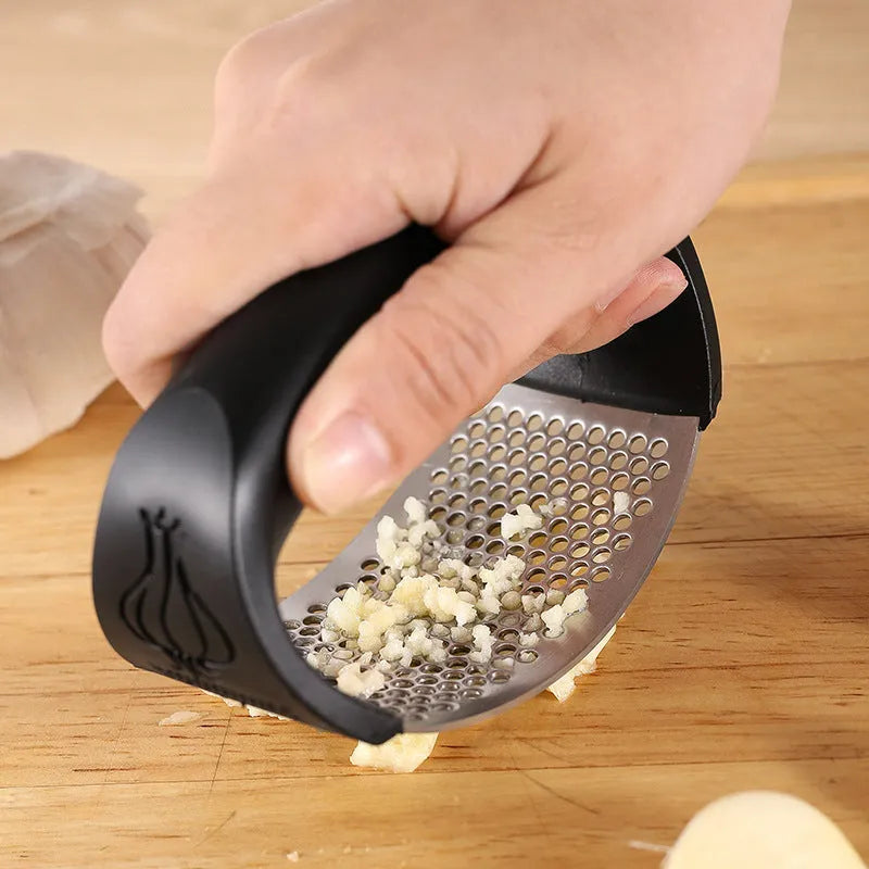 Stainless steel garlic press with modern design in choice of four colours for kitchen use