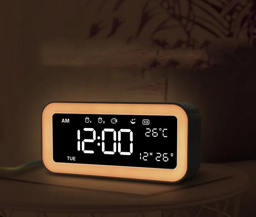 Rectangular multifunctional LED atmosphere light alarm clock with digital display and quartz glass mirror in blue or pink plastic casing