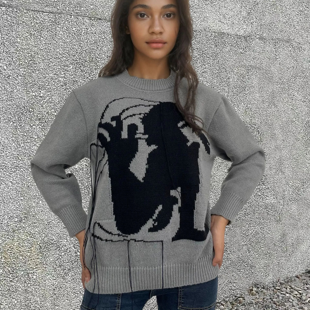 Women's grey alpaca wool sweater with tassel detailing and abstract pattern