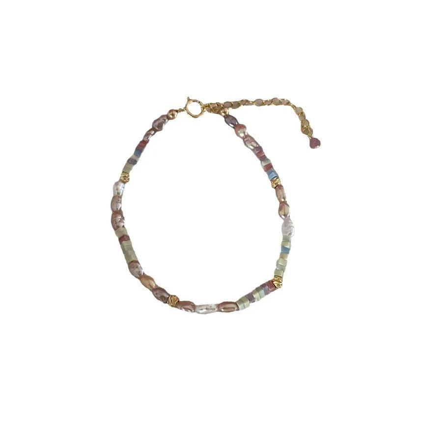 Women's 14K gilded purple silver natural pearl bracelet and necklace set showing irregular mini pearls