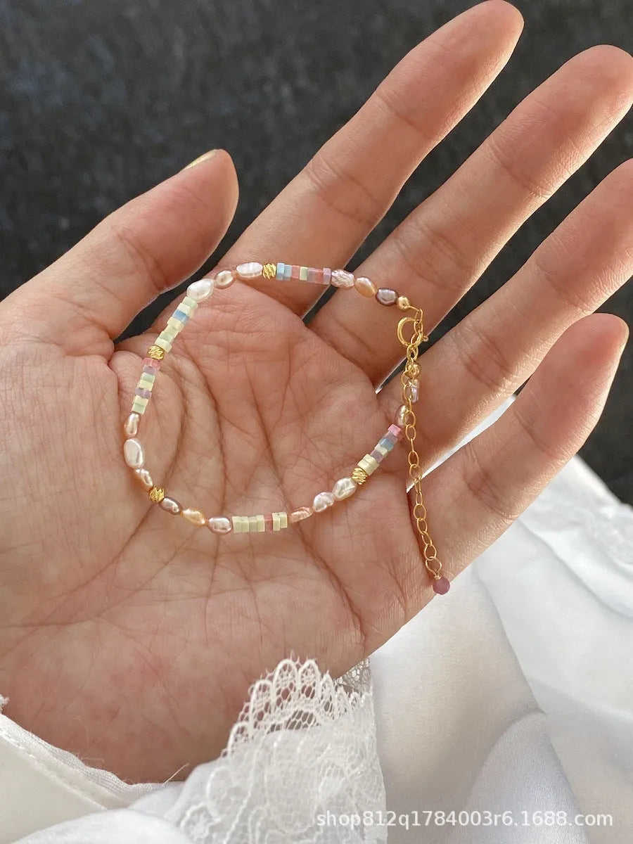 Women's 14K gilded purple silver natural pearl bracelet and necklace set showing irregular mini pearls