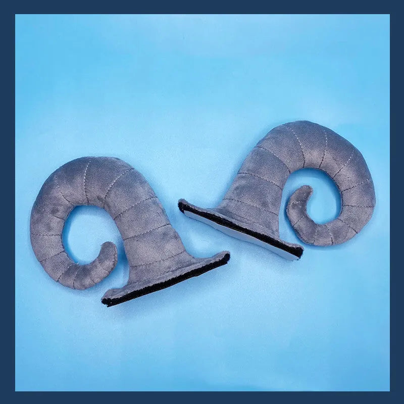 A pair of composite fibre demon horn ornaments for a motorcycle helmet in black, pink, brown, or grey.