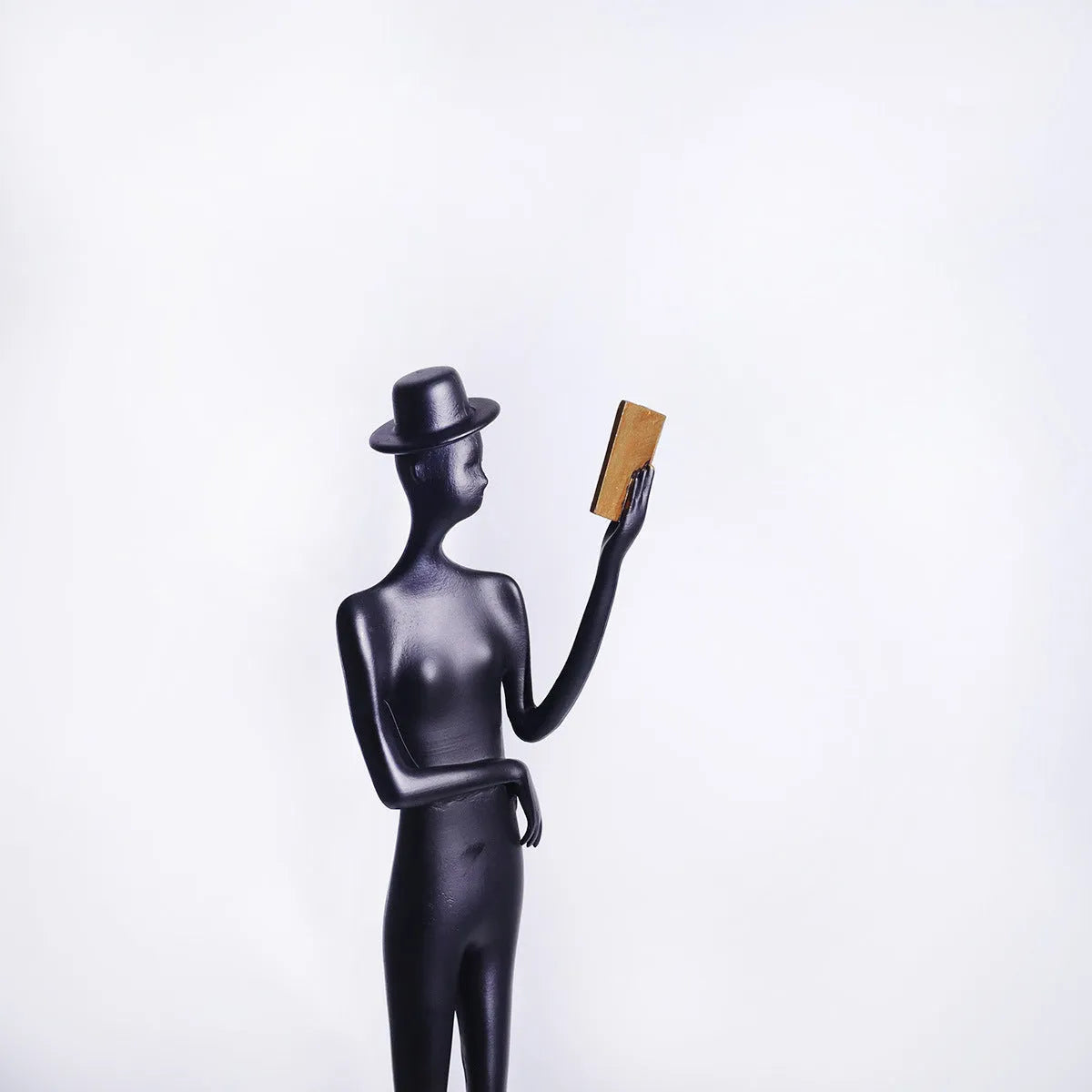 Black cast aluminium reading woman desktop sculpture modern minimalist decor