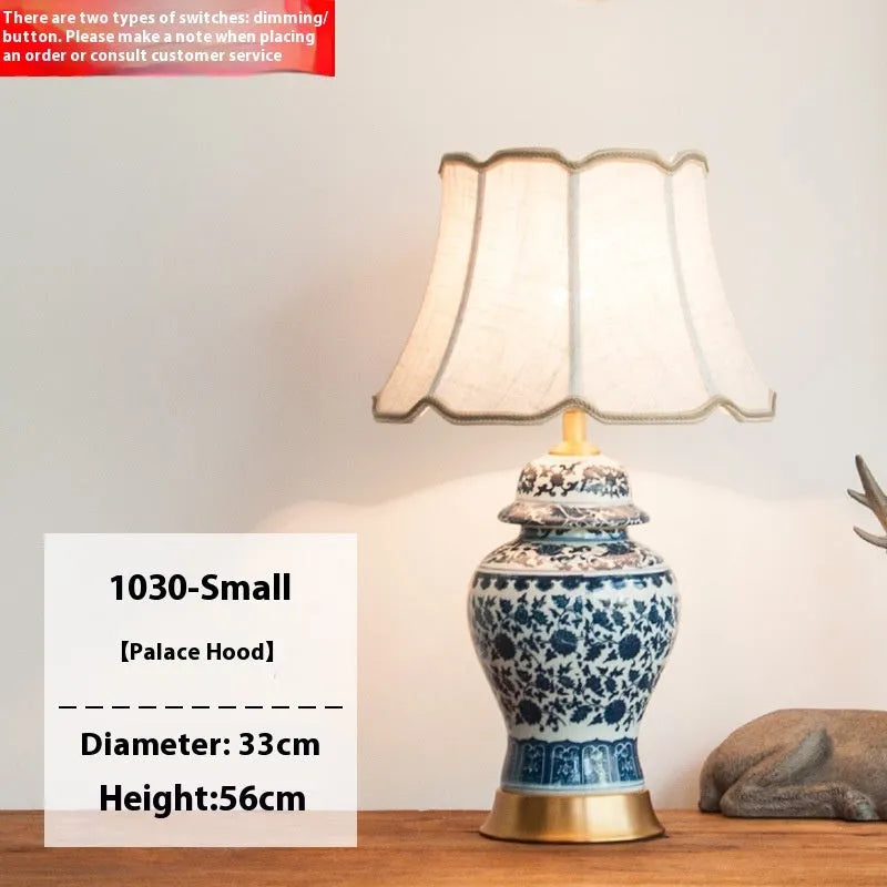 Blue and white porcelain Chinese style table lamp with ceramic base and cloth shade.
